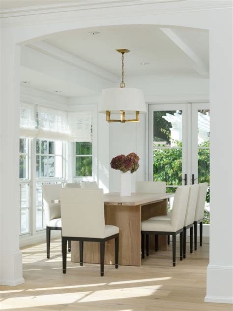 If you want a really grand dining room, then you can opt for two dining armchairs at the head and foot of your table. White Dining Room | Houzz