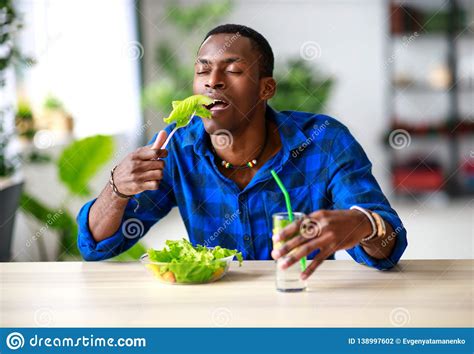Healthy Eating Happy Young Black Man Eating Salad In Morning In