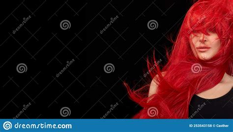 dyed hair care and fashion concept fashion model girl with windswept long dyed red hair stock