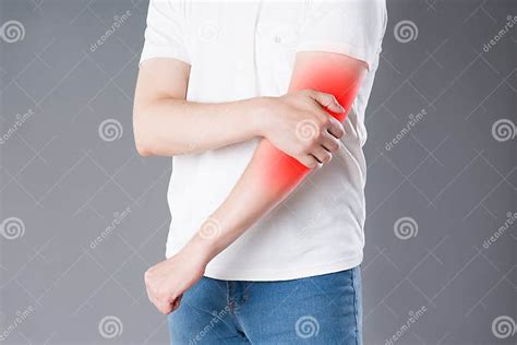 Man Suffering From Pain In Elbow Joint Inflammation Stock Image