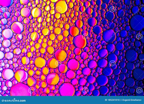 Colorful Drops Of Oil On The Water Rainbow Or Spectrum Colored Circles
