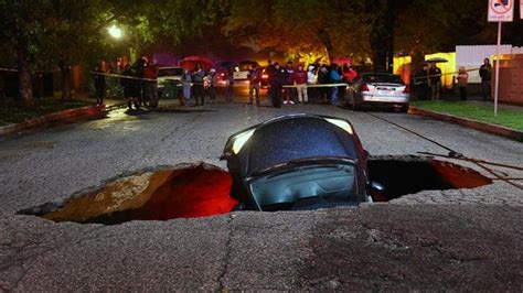 Huge Sinkhole Swallowed Two Cars Youtube