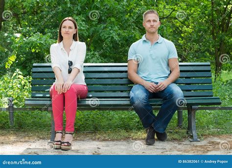 Shy Man And Woman Sitting On Bench Stock Image Image Of Lifestyle