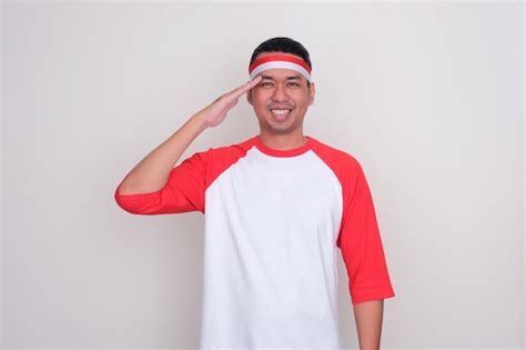 Premium Photo Indonesian Man Doing Salute Pose With Happy Expression