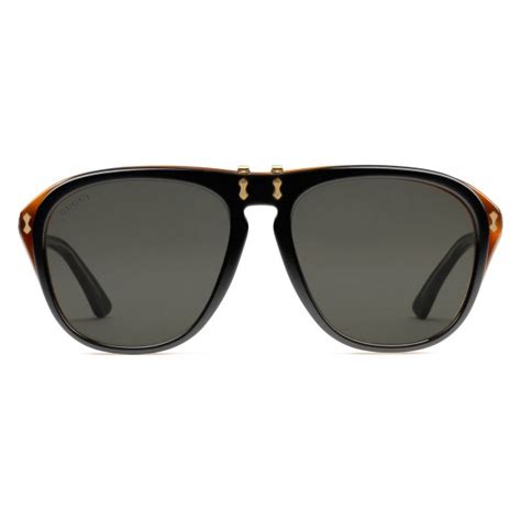 gucci round acetate sunglasses light and black turtle acetate with flip up detail gucci