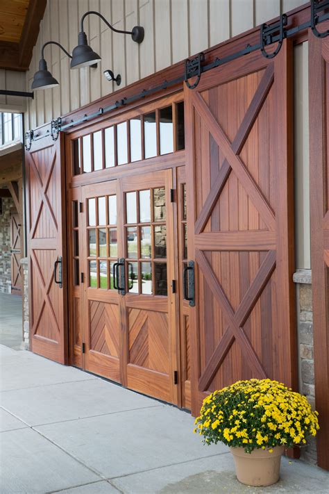 The woodfold 2100 features acoustical sealed track, and interlocking jamb molding with sound gasket. Grand Barn Doors in 2020 | Exterior barn doors, Exterior ...