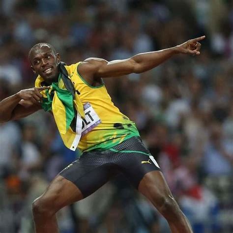 Download Usain Bolt Does His Iconic Pose Wallpaper