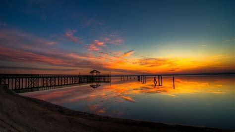Online Crop Silhouette Photography Of Dock On Sea Lake Sunrise Sky