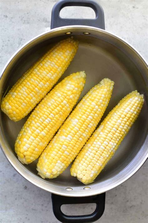 All you need to do is trim the silk at the top of each cob and set the cobs on an oven rack. How to boil corn