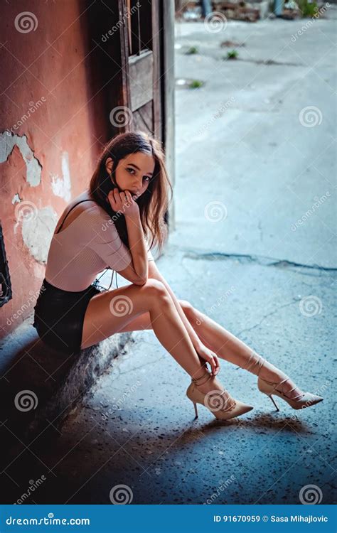 girl in skirt sitting on the stairs stock image image of people glamour 91670959