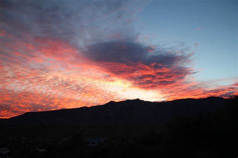 Hot Pink And Orange Cotton Candy Dawn Clouds Over The Mountains In