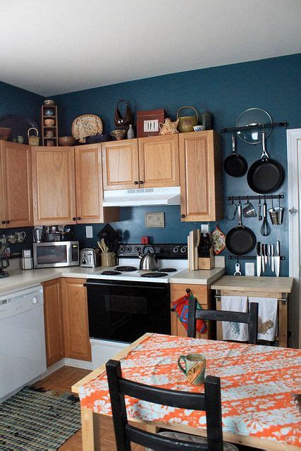 The simple lines and beautiful form of kitchen cabinets decorate the kitchen. Kitchen with New Hanging Pots & Prep Station | Blue kitchen walls, Kitchen colors, Teal kitchen ...