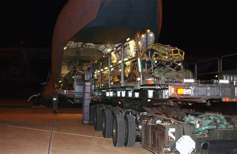 A Tunner 60k Loader Loads Equipment And Gear Onto A Us Air Force Usaf