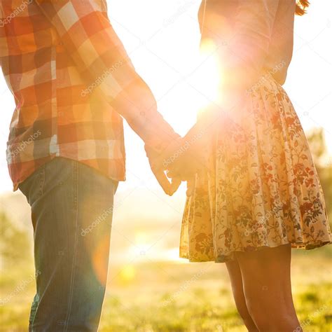 Young Couple In Love Walking In The Autumn Park Holding Hands — Stock