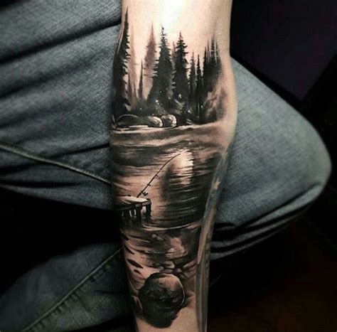 A Man S Arm With A Black And White Tattoo On It Depicting A Lake