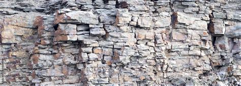 Rock Cliff Face Background Dangerous Vertical Wall With Protruding