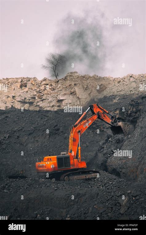 An Earth Mover Collects Coal At An Open Cast Mine In Dhanbad India