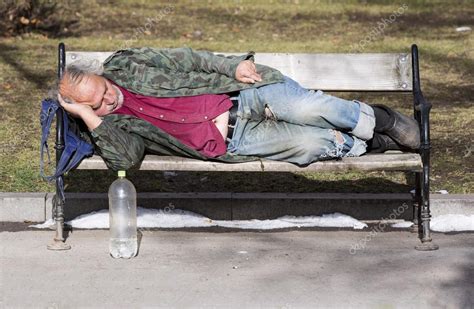Homeless Man Sleeping On A Bench Stock Editorial Photo © Belish 95915380