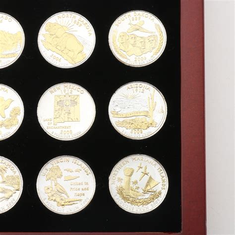 Collection Of Fifty Six Gold And Silver Highlighted Statehood Quarters