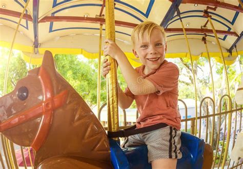 Little Boy On A Carnival Carousel Stock Image Image Of Holiday