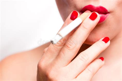 Red Lips And Red Nails Smoking Cigarette V2 Stock Photo