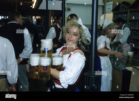 Oktoberfest Waitress Carrying Beers Stock Photo Alamy