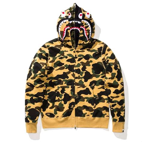 Founded by nigo in 1993, a bathing ape® emerged from its underground harajuku beginnings to become one of the most iconic streetwear symbols in the world, with their signature designs including the ape head, bape® camo, bape sta™, shark hoodie. Jual BAPE 1st Camo Shark Full Zip Double Hoodie - Yellow ...