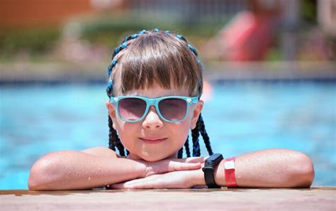 Premium Photo Young Joyful Child Girl Resting On Swimming Pool Side