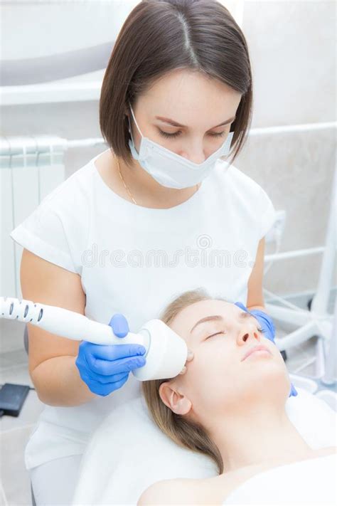 Beautician Doctor Doing Rf Lifting Procedure For Flawless Woman Face