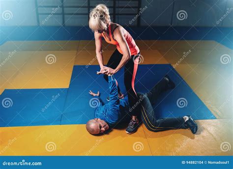 Woman Fights With Man Self Defense Technique Stock Photo