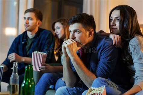 Friends With Beer And Popcorn Watching Tv At Home Stock Image Image
