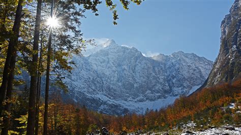 Forest And Julian Alps Mountain Slovenia With Sunbeam And Blue Sky 4k