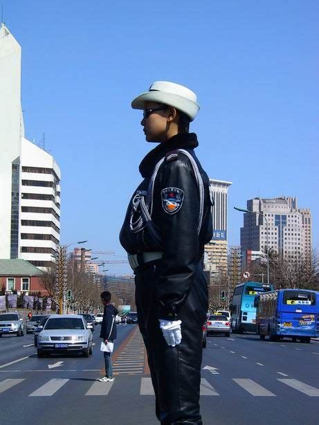 Chinese Policewoman In Full Leather Uniform