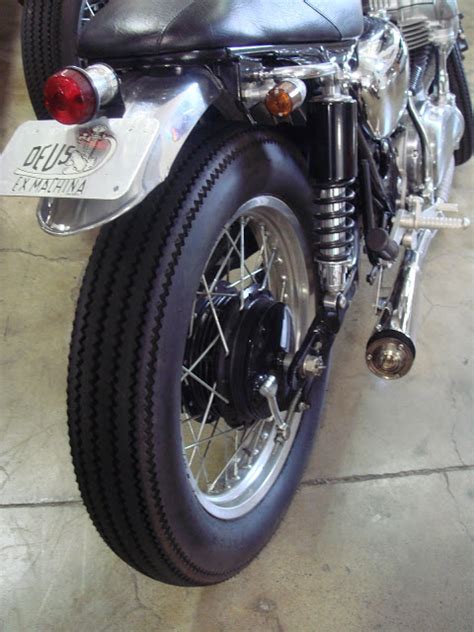 Woman drives on a motorbike. Vintage Rubber for your Cafe Racer - Firestone Tyres ...