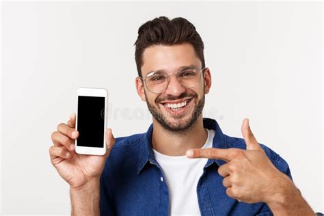 Young Man Showing His Brand New Smart Phone Isolated On White Stock