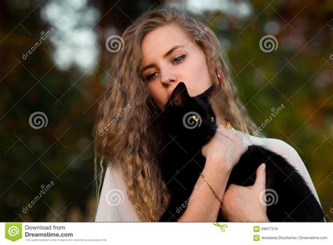 Cutebeautifullovely Girl With Black Catupset Girl Held And Caress