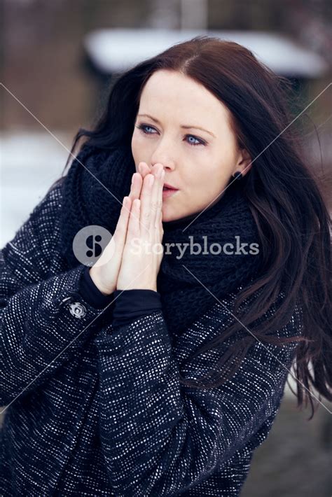 Woman Shivering In The Frozen Outdoors Royalty Free Stock Image