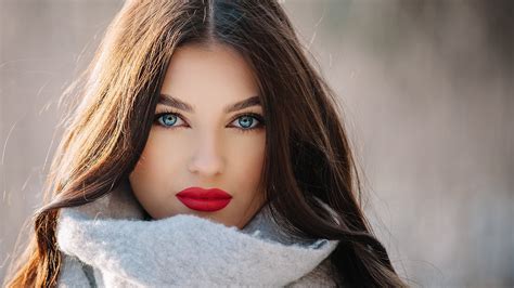 Closeup View Of Beautiful Blue Eyes Girl Model Is Wearing Ash Woolen Dress Standing In Blur