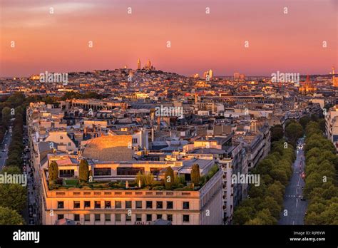 The Sacre Cœur And Montmartre At Sunset From The Rooftop Of The Arc De