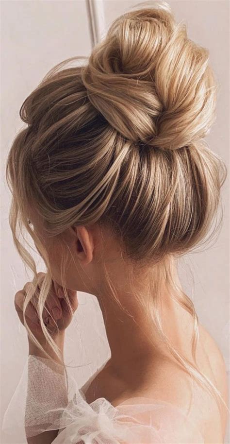 Trendiest Updos For Medium Length Hair To Inspire New Looks High Bun With Volume