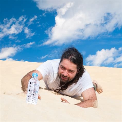 Premium Photo Thirsty Man In The Desert Reaches For Water