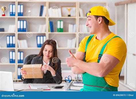 The Postman Delivering Parcel To The Office Stock Photo Image Of