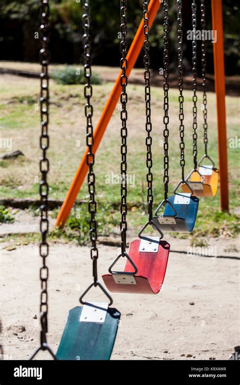 Empty Colorful Swings At The Park Stock Photo Alamy