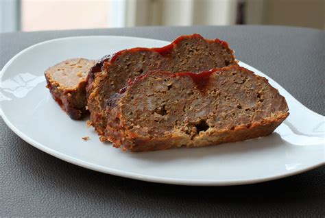 This meatloaf recipe is easy to make, holds together, and has the best glaze on top! Cheddar Meatloaf Recipe and Tangy Sauce