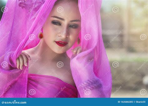 Beautiful Thai Woman Wearing Traditional Thai Dress With Silk Fabric