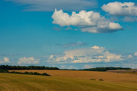 Agricultural Landscape Fields After Harvesting Clouds And Blue Sky