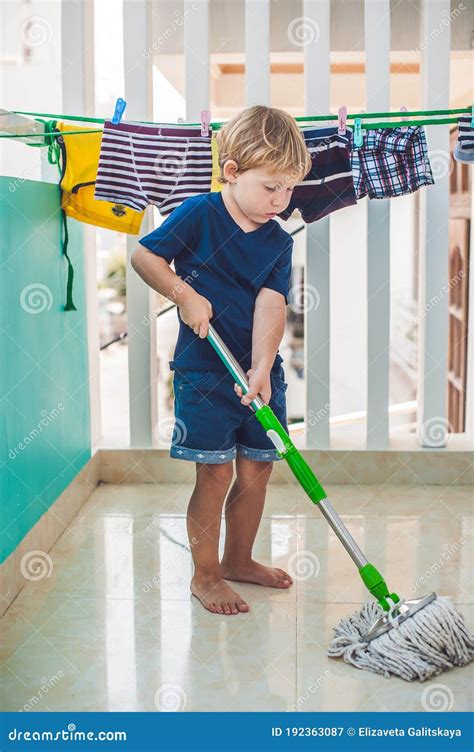 Kid Boy Cleaning Room Washing Floor With Mop Little Home Helper Stock