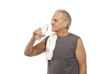 Image Of A Senior Man Drinking Water After Exercising Stock Image