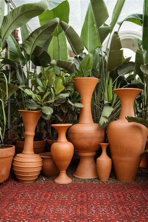 Decorative Clay Vases And Flower Pots Standing On A Floor · Free Stock