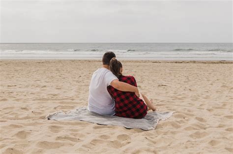 Free Photo Embraced Couple Posing On Beach